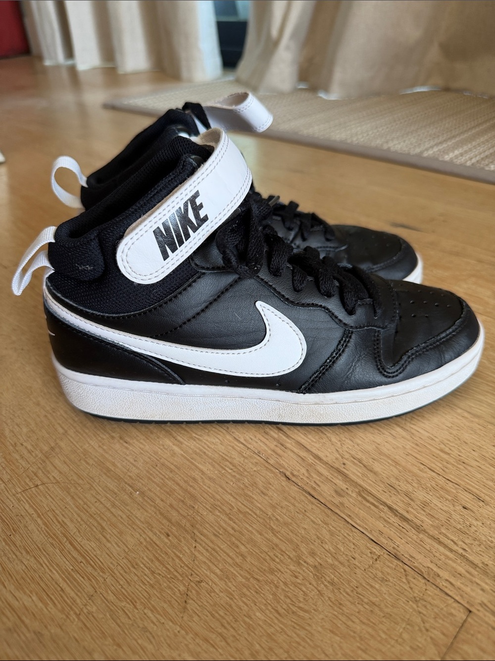 Nike Black and White High-Top Sneakers with Swoosh Strap